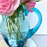 Old pitcher in blue glass