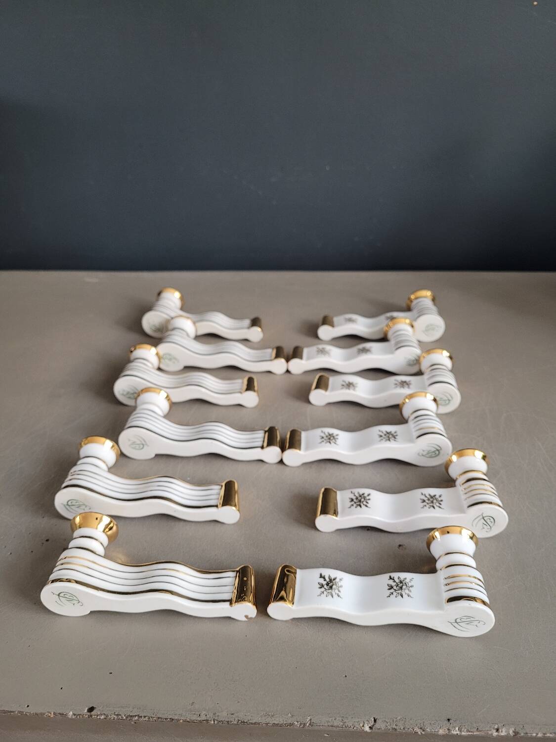 12 Limoges art porcelain knife rests in their case