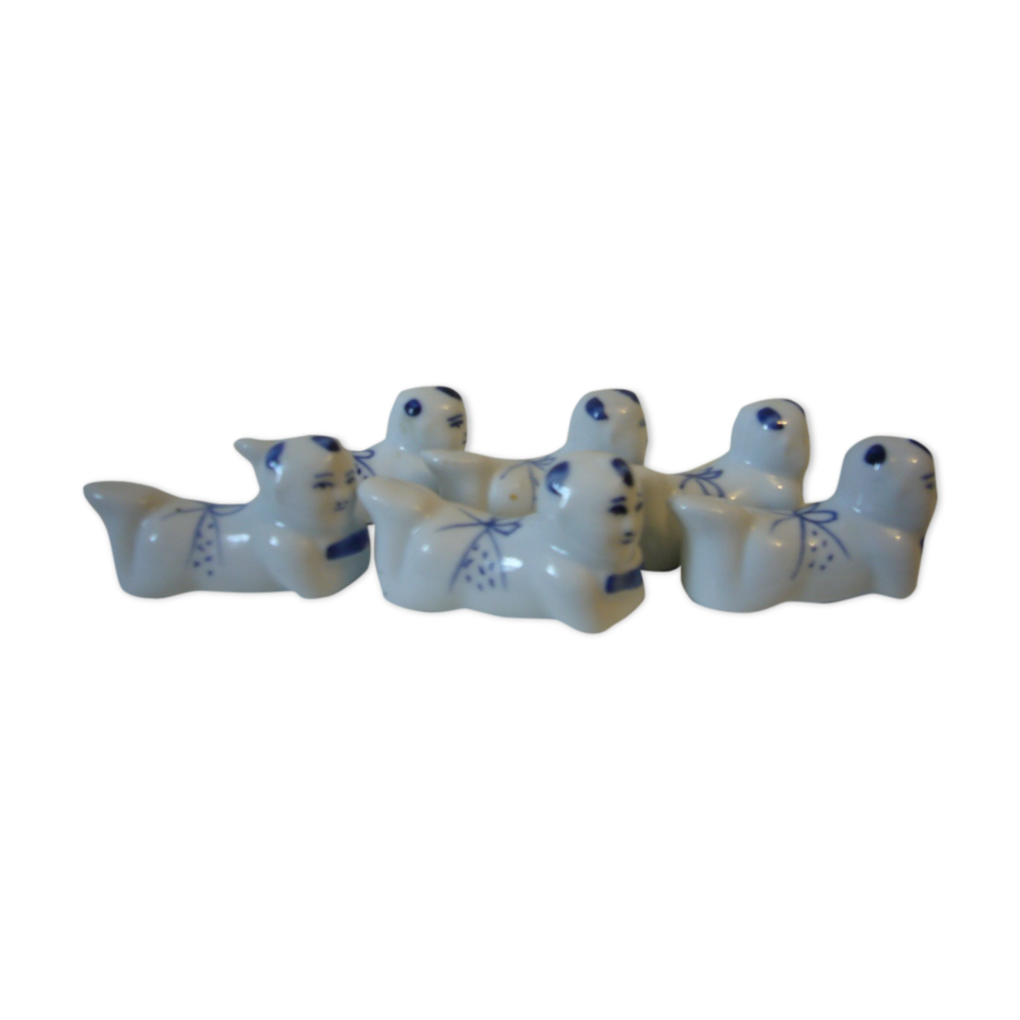 Wears vintage porcelain knives