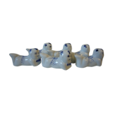 Wears vintage porcelain knives