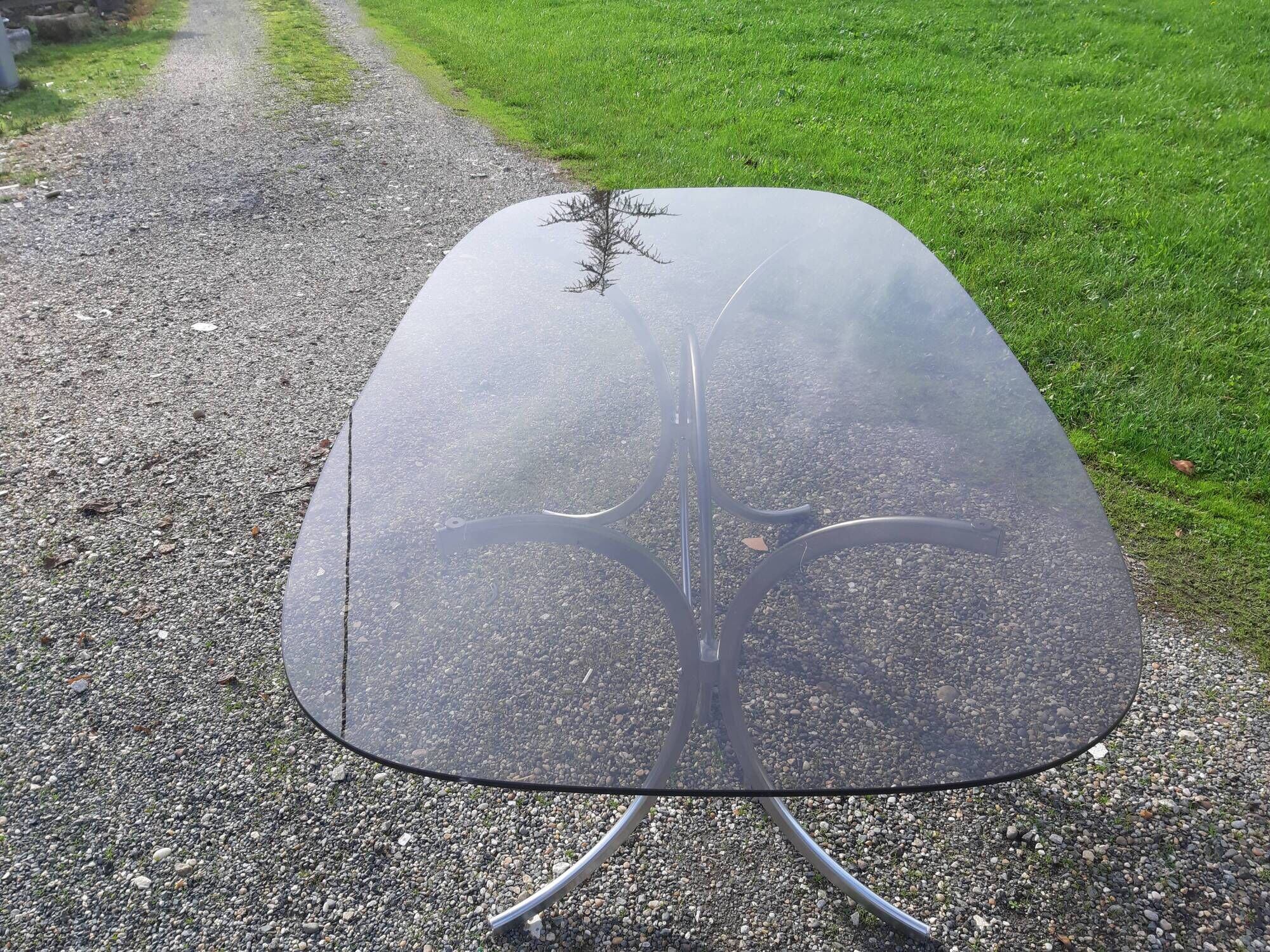 Vintage table of the 70s in chrome and smoked glass