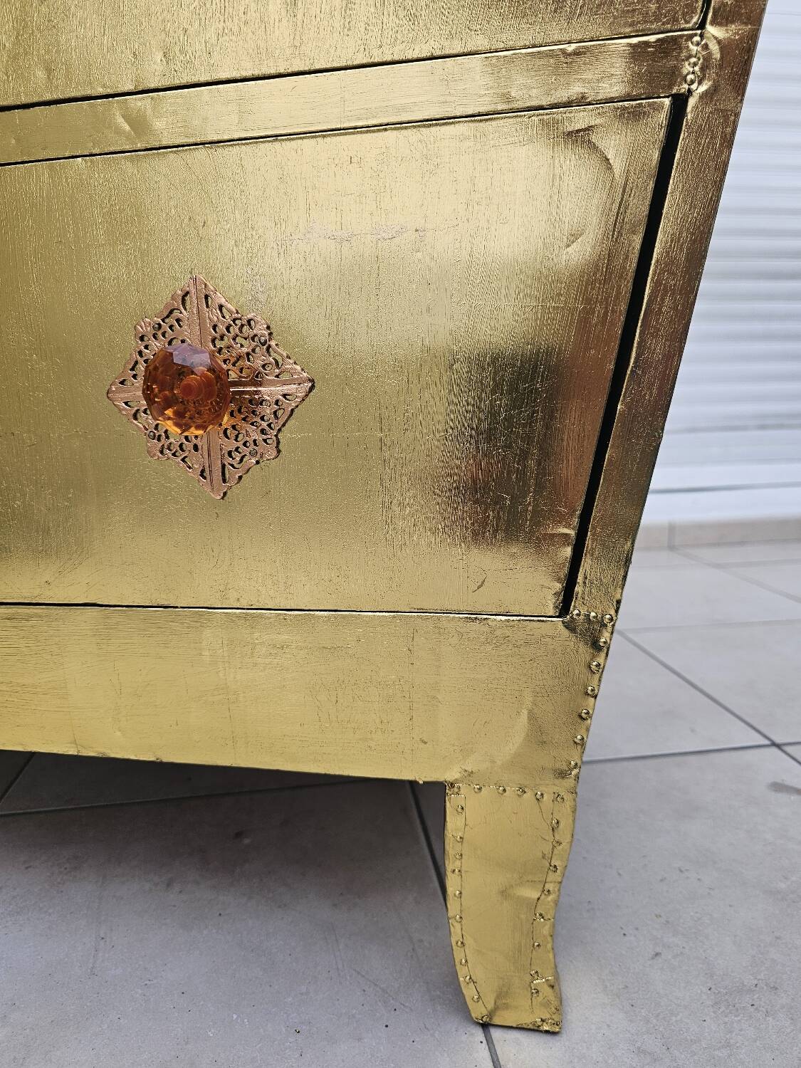 Handcrafted commode fully dressed in brass, original piece and
