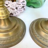 Pair of old candle holders in golden brass