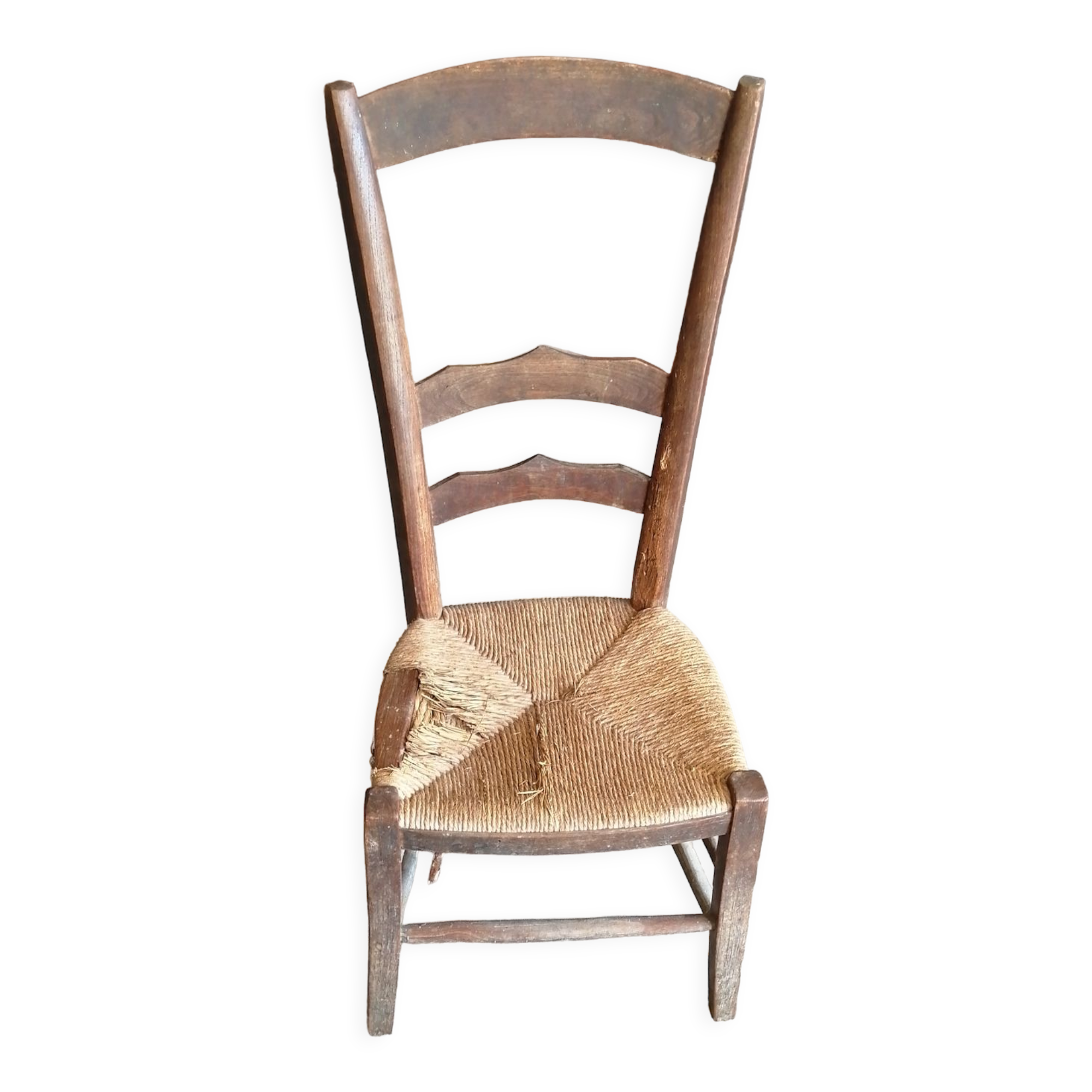 Low straw chair called "nurse"