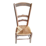 Low straw chair called "nurse"