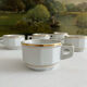 5 vintage porcelain bistro coffee cups from Paris with gold trim.