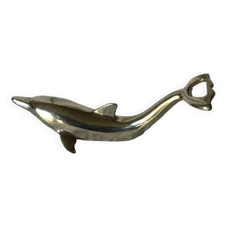 Bottle opener in the shape of a dolphin.