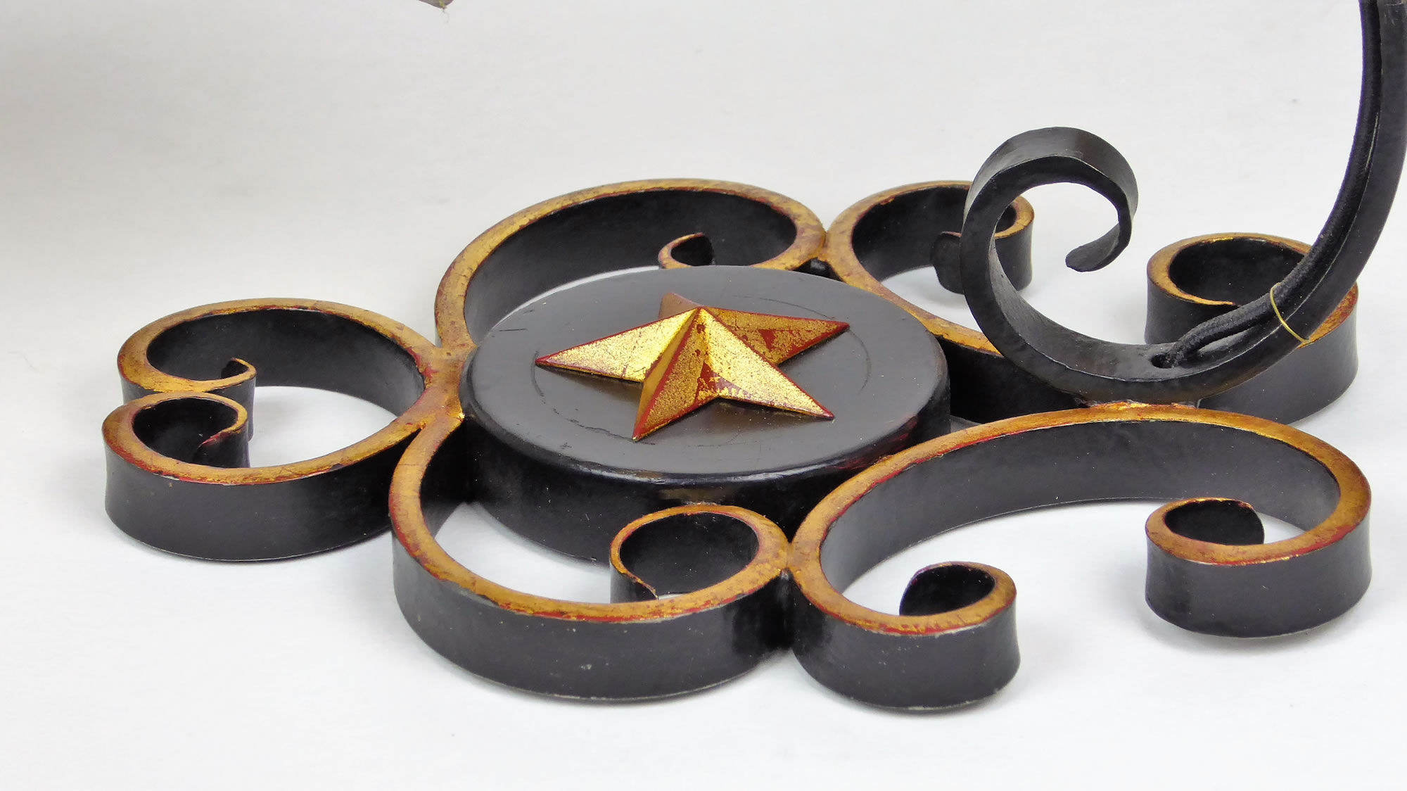 1950 gold star and black metal sconces