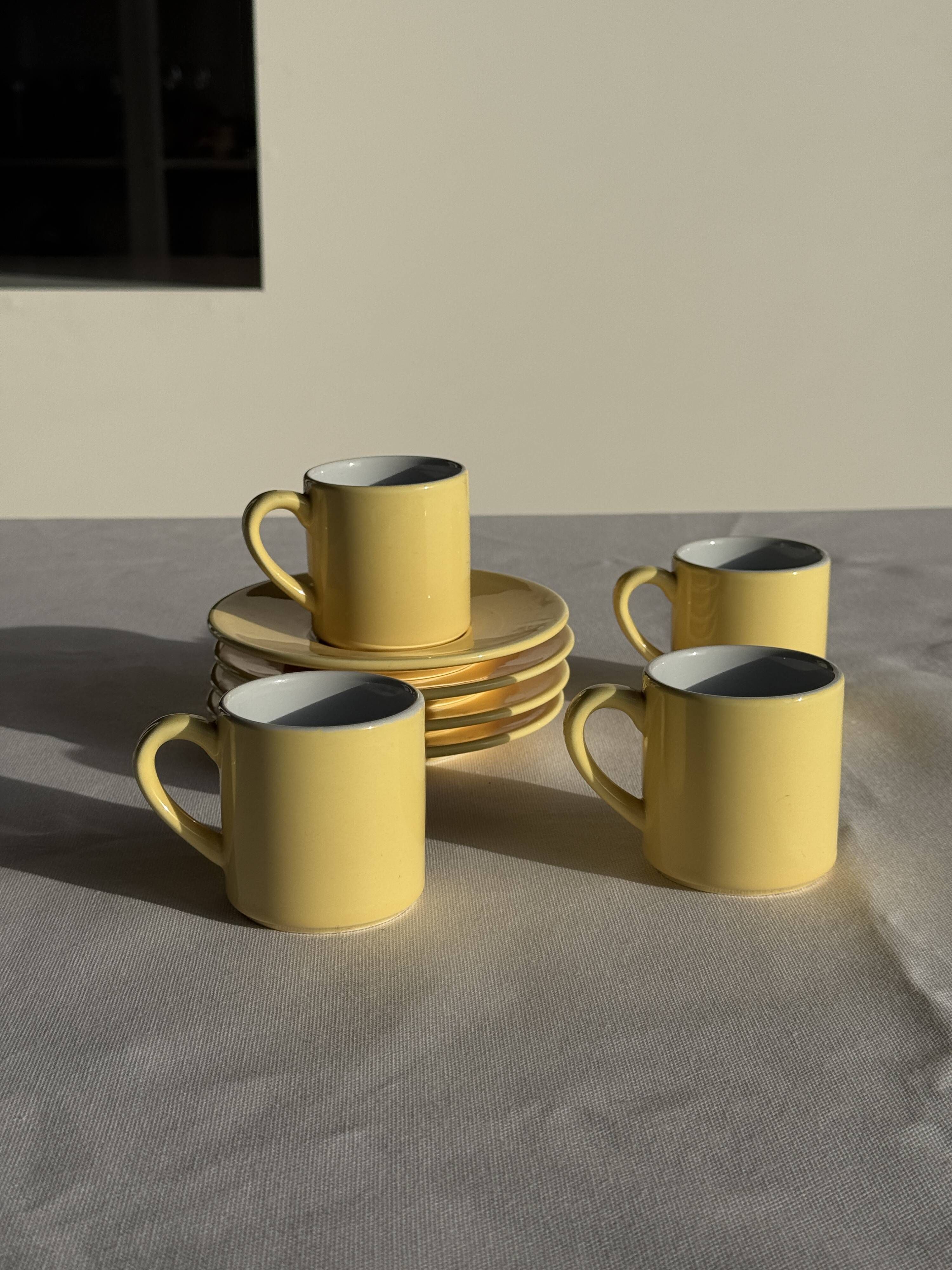 Set of 4 vintage yellow Italian espresso cups and saucers.