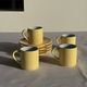 Set of 4 vintage yellow Italian espresso cups and saucers.