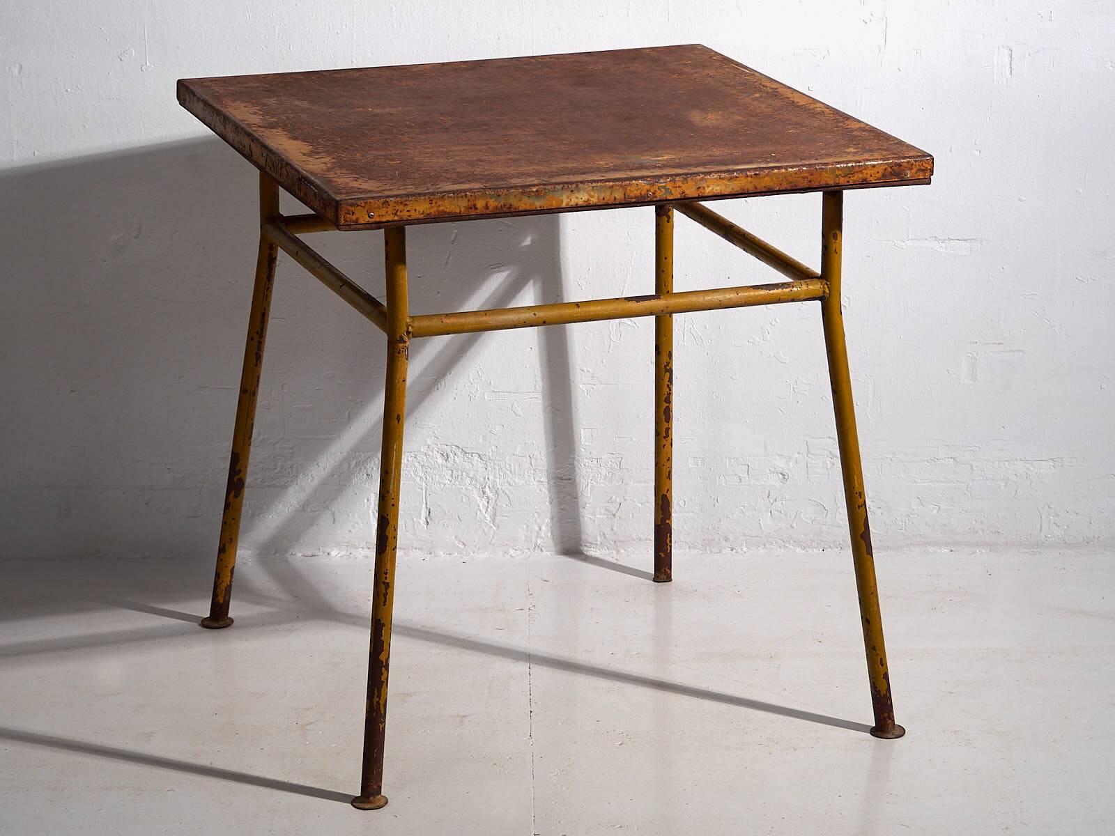 Antique ochre-colored outdoor table (c.1920)