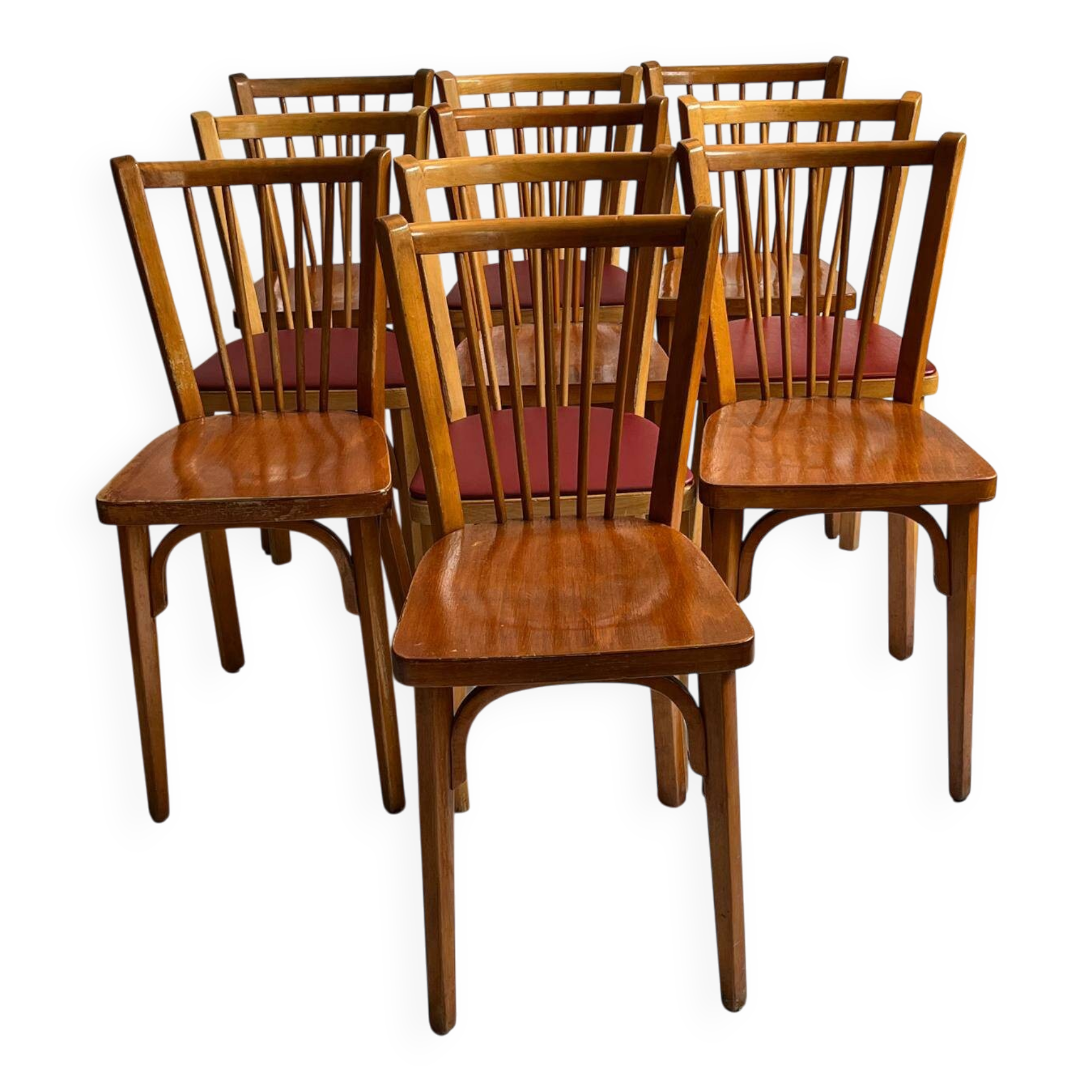 Set of Baumann bistro chairs with a mix of wooden seat and faux leather.