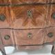 Transitional style chest of drawers in rosewood and amaranth veneer, 20th century.