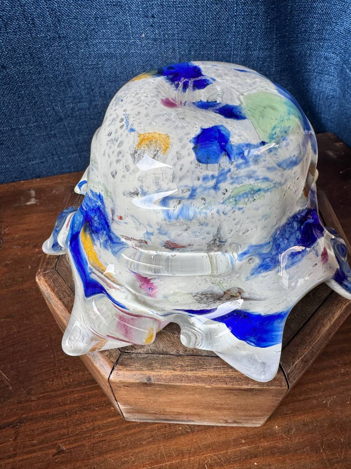 Multi-layer glass ashtray with metallic oxide inclusions.