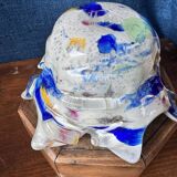 Multi-layer glass ashtray with metallic oxide inclusions.