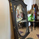 Large old trumeau mirror in black and gilded wood Napoleon style