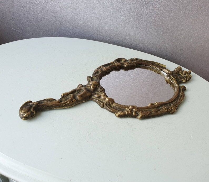 Hand mirror in brass art deco 30 years France