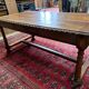Large antique carved wooden desk in Renaissance style