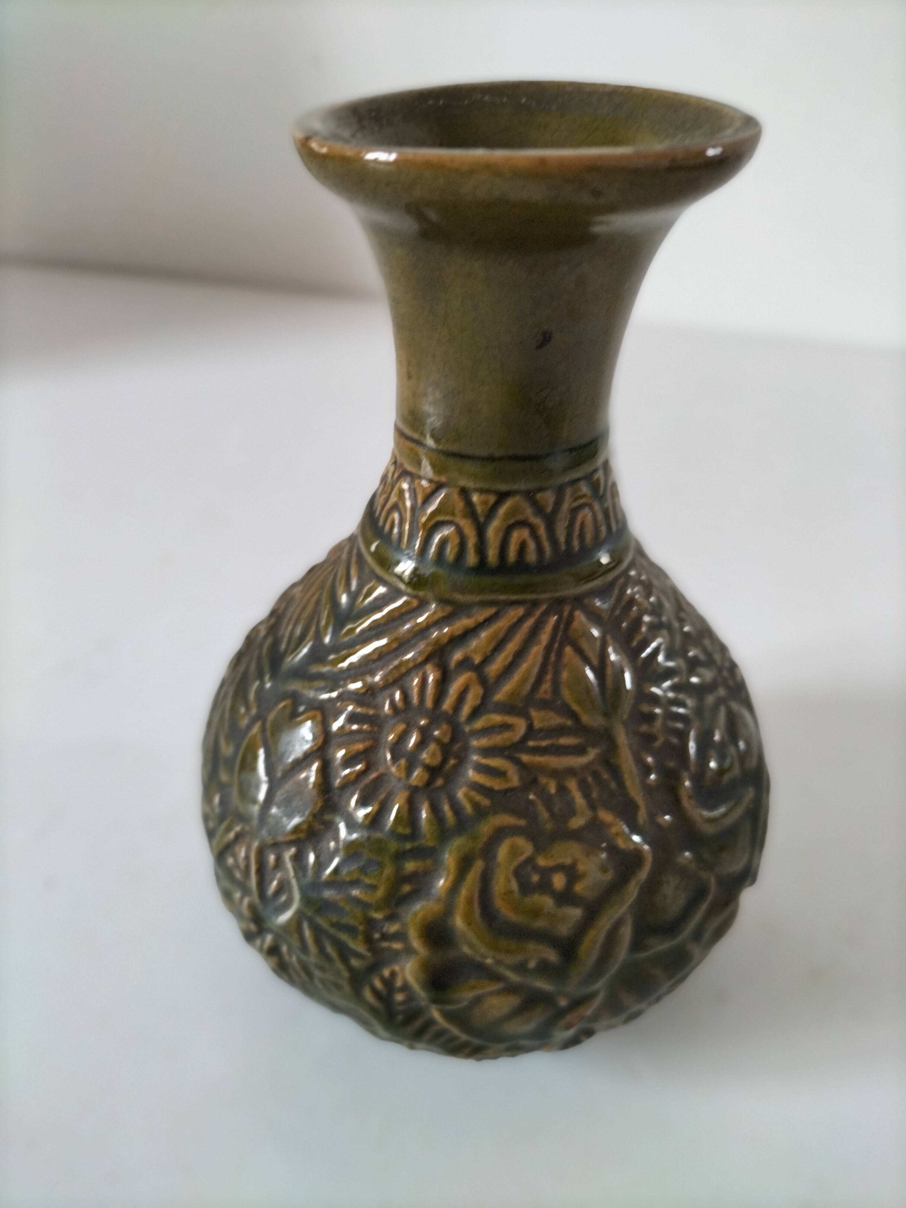 Small glazed vase with raised floral decoration