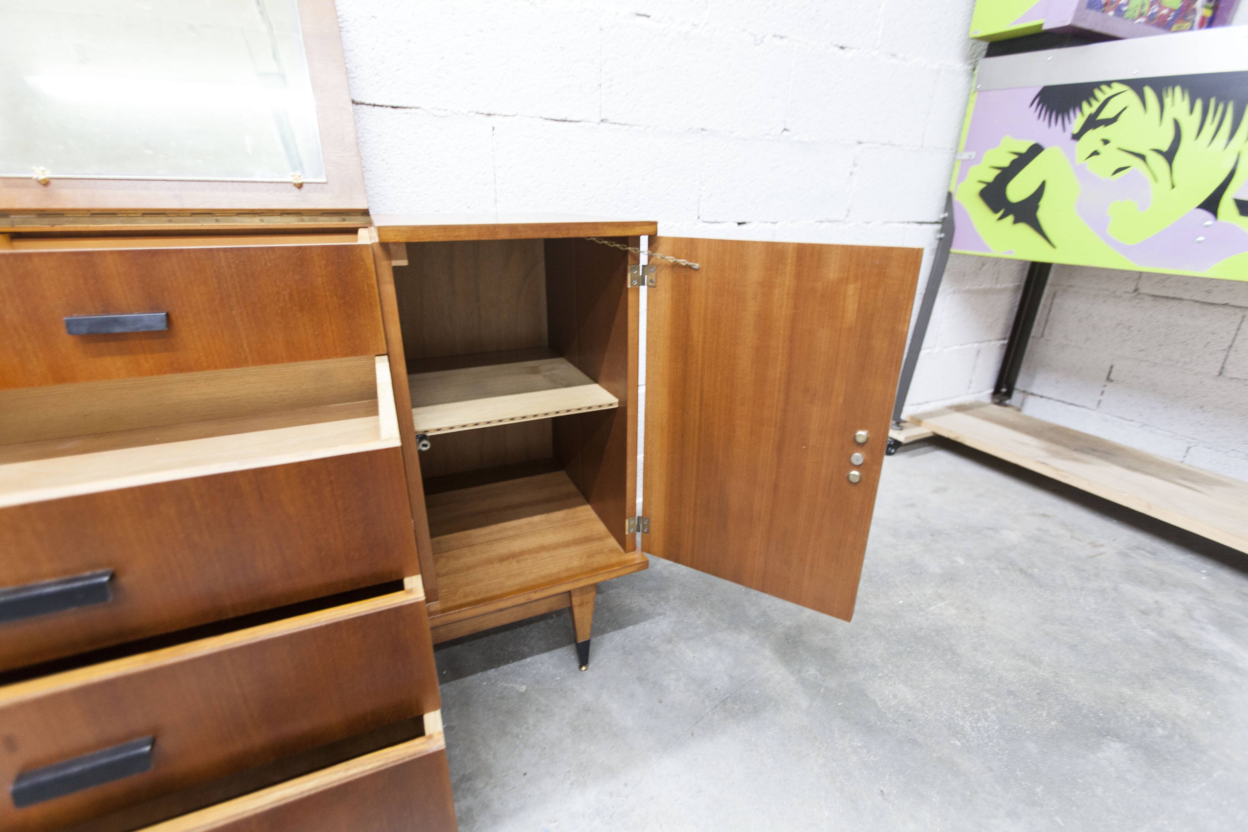 1960s teak sideboard with 4 drawers, 2 doors, and a mirror.