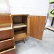 1960s teak sideboard with 4 drawers, 2 doors, and a mirror.
