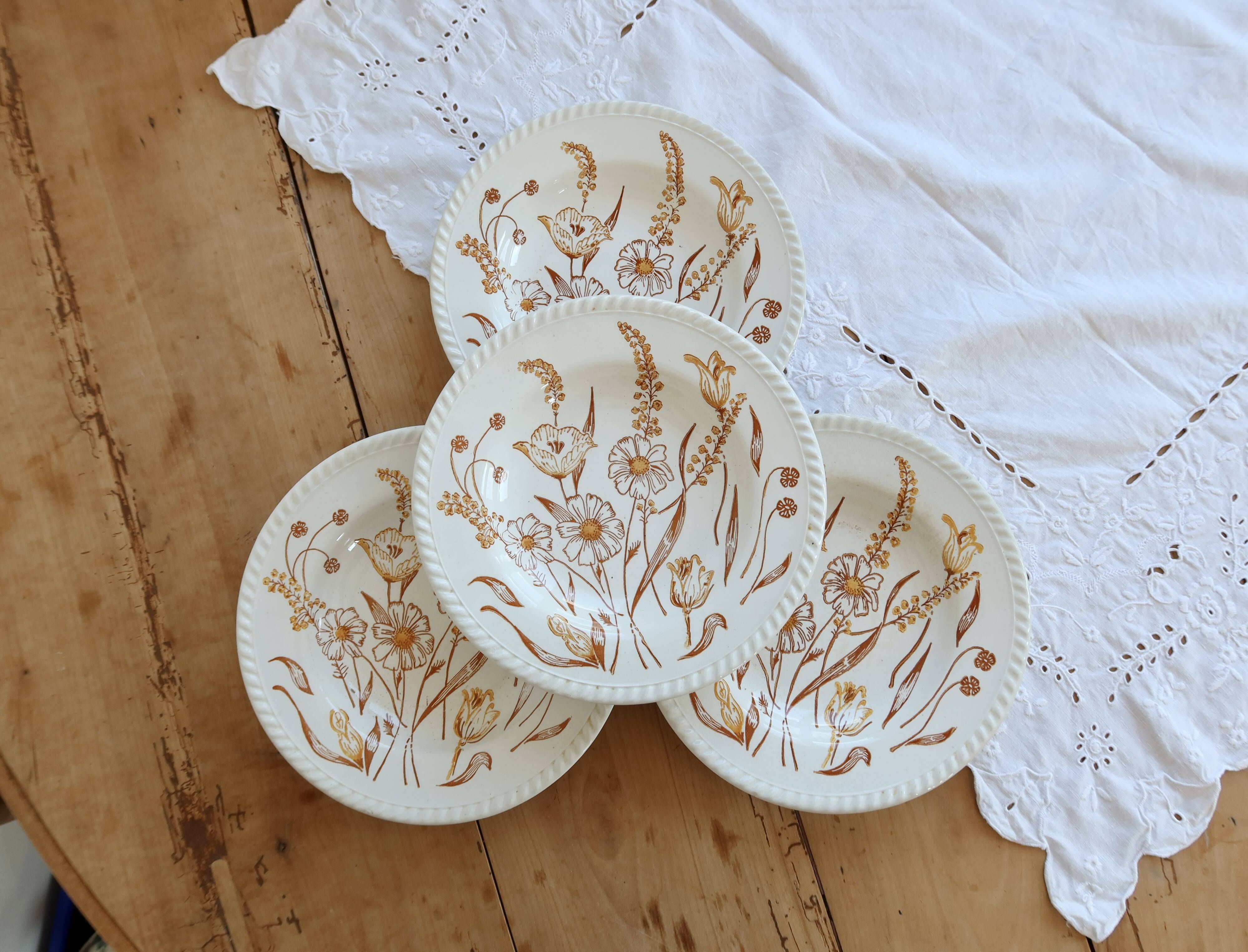 4 vintage deep plates with a brown floral design