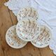 4 vintage deep plates with a brown floral design