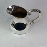 Water jug on feet decorated with ebony of hallmarked silver from the 1940s. The jug is in great anti