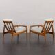 Pair of Kai Kristiansen Paperknife lounge chairs in teak and natural wool