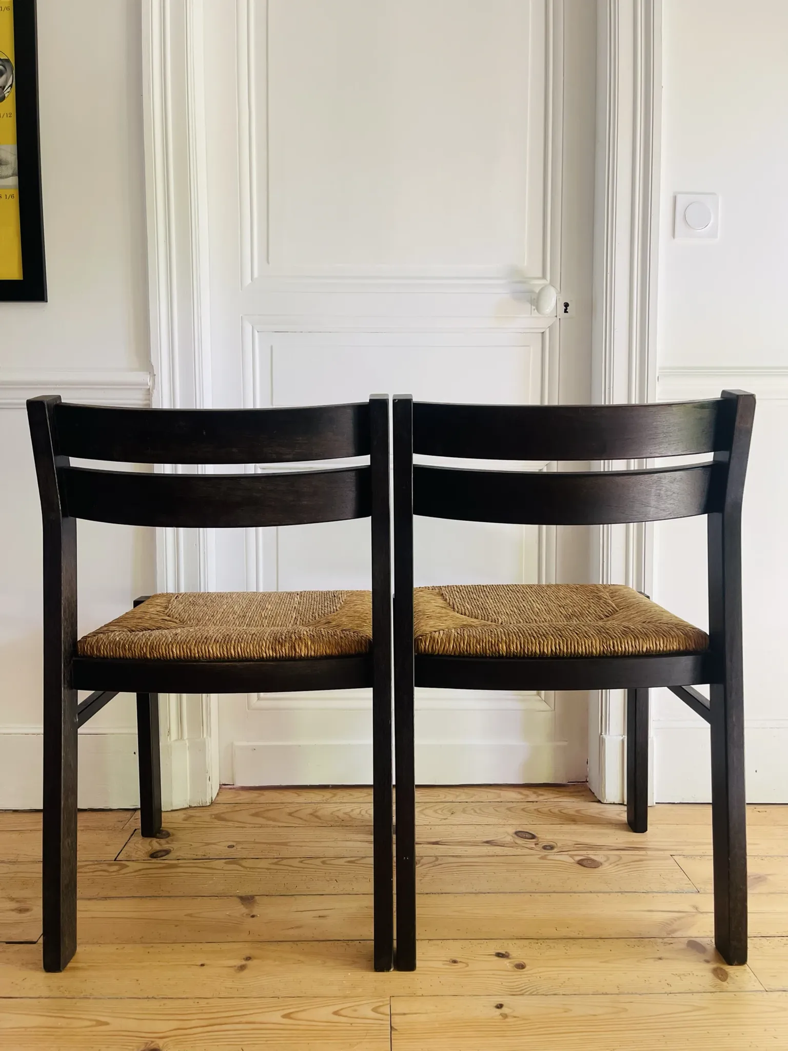 Pair of straw-seated wooden chairs in the regain style.