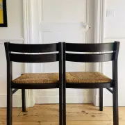 Pair of straw-seated wooden chairs in the regain style.