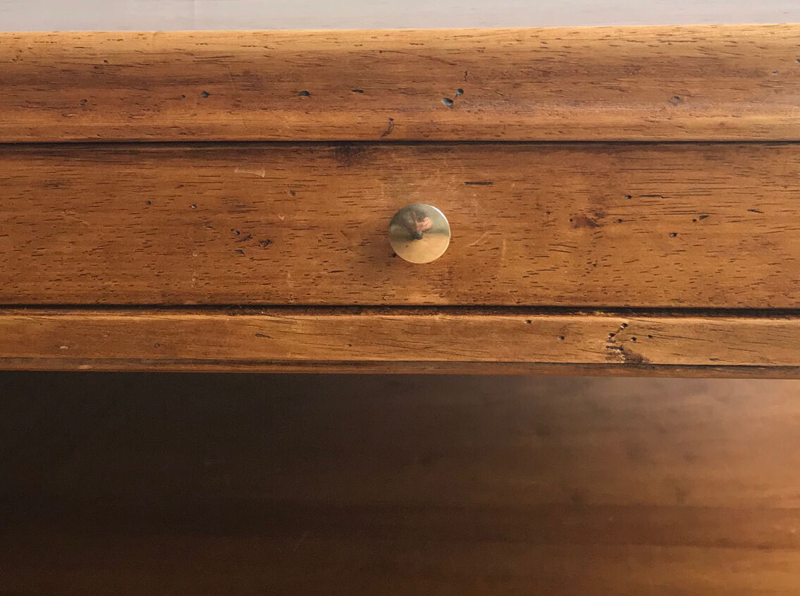 A solid wood-marked coffee table.