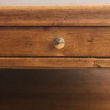 A solid wood-marked coffee table.