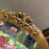 Oval mirror in gilded wood with knot, 32x37 cm