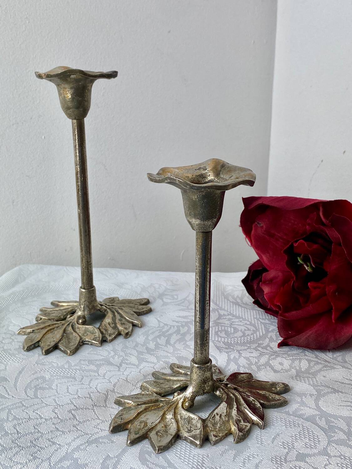 Pair of metal flower candlesticks