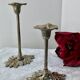 Pair of metal flower candlesticks