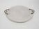 Assiette de service perforée en métal blanc, attribuée à Matthieu Mategot, années 1960.