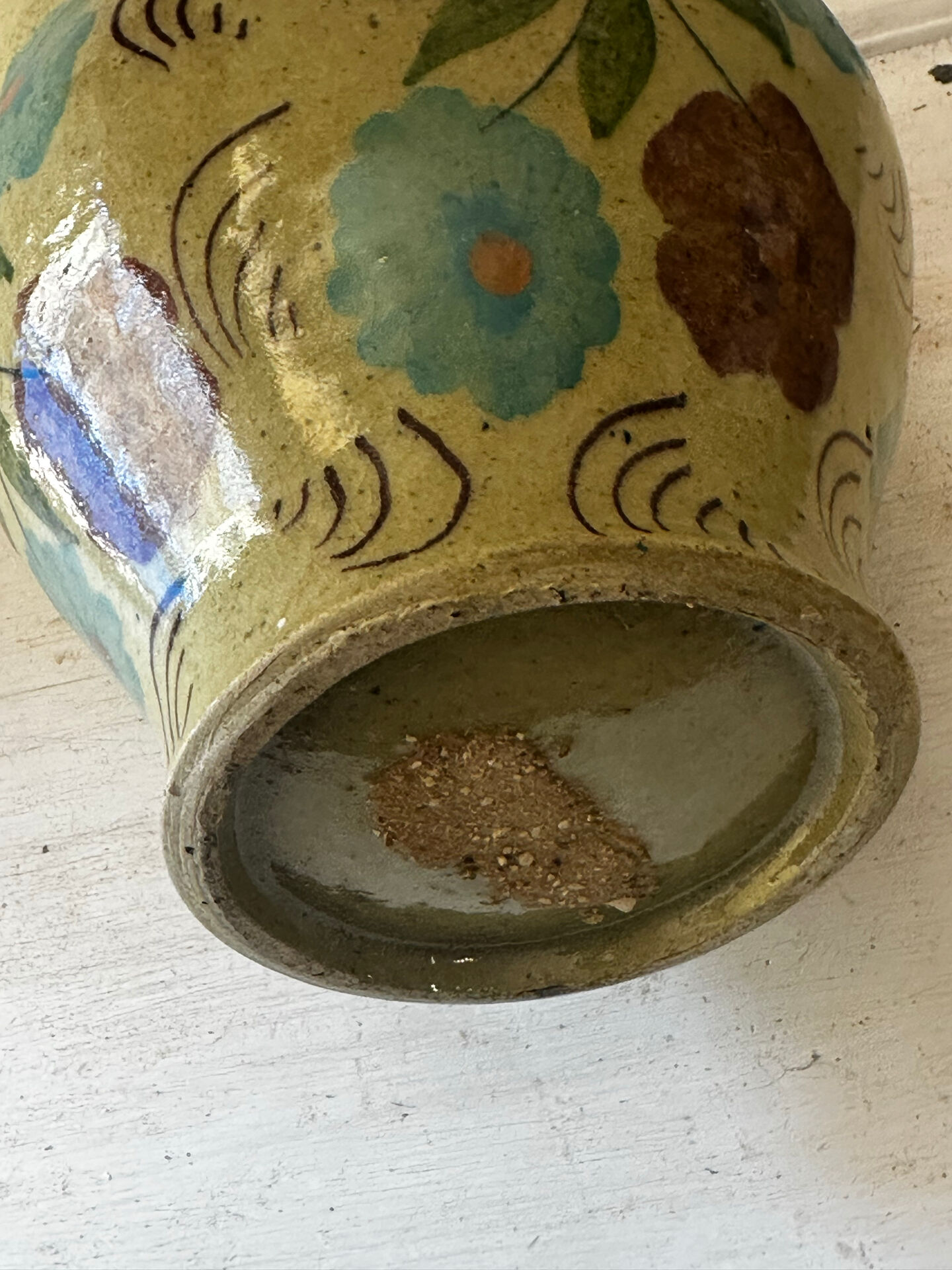 Mediterranean ceramic jug with floral decoration.