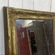 19th-century mirror in gilded wood and plaster.