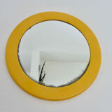 Round wall mounted mirror in yellow plastic 1970