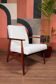 Vintage salon chair in white boucle with a 1950s design.
