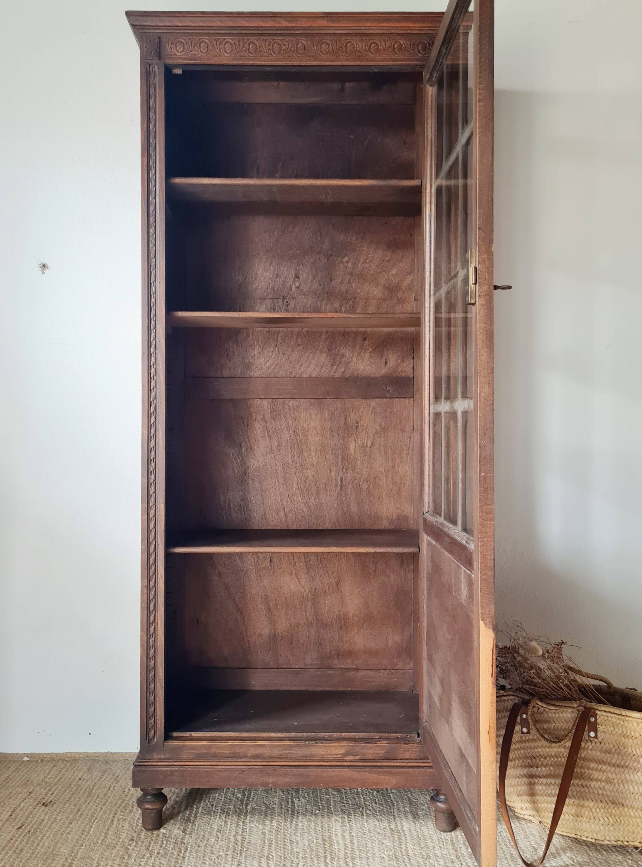 Old glass-fronted library in solid wood