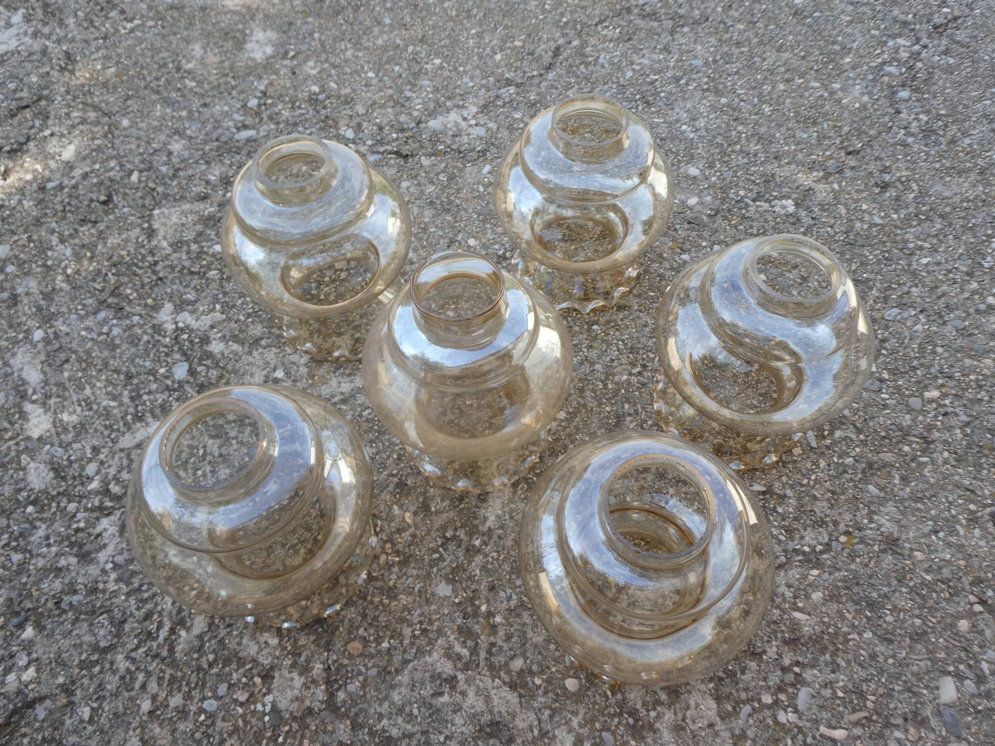 Set of 6 amber glass globes.