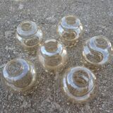 Set of 6 amber glass globes.