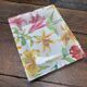Ensemble porcelaine Lancel bouquets de Lys colorés vase et cendrier vide poche