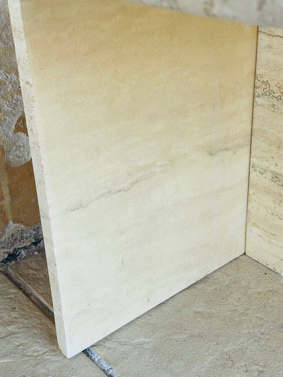 Vintage side table in travertine, circa 1980s.