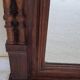 Henri II trumeau mirror for a fireplace in solid walnut.