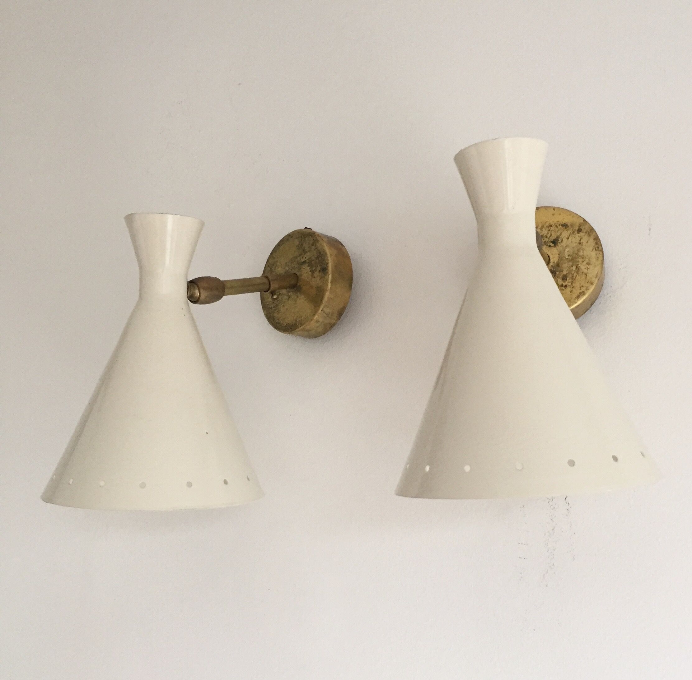 Pair of white and brass sconces