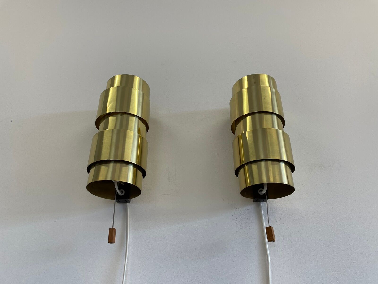 Pair of Scandinavian teak and brass sconces