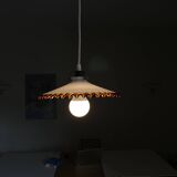 Old pendant light with a white opaline glass shade and a wavy border.